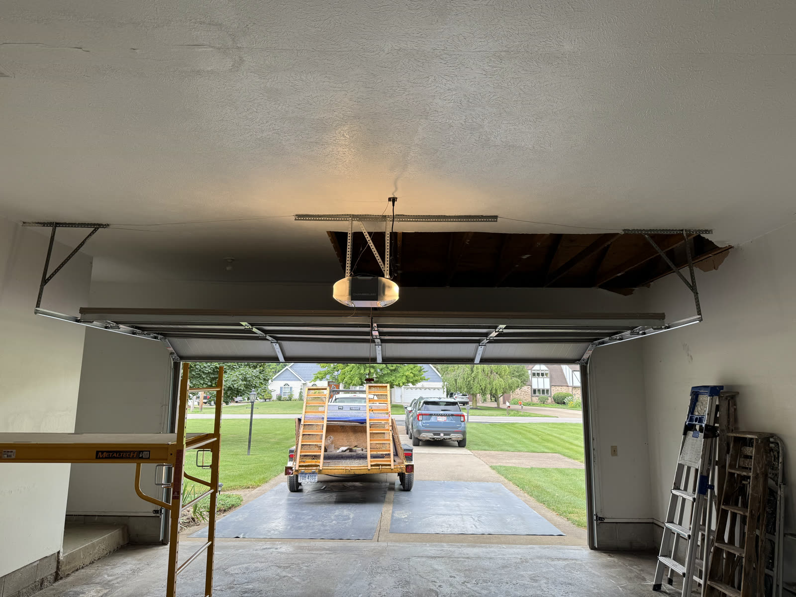 The original garage ceiling, already opening up near the door.